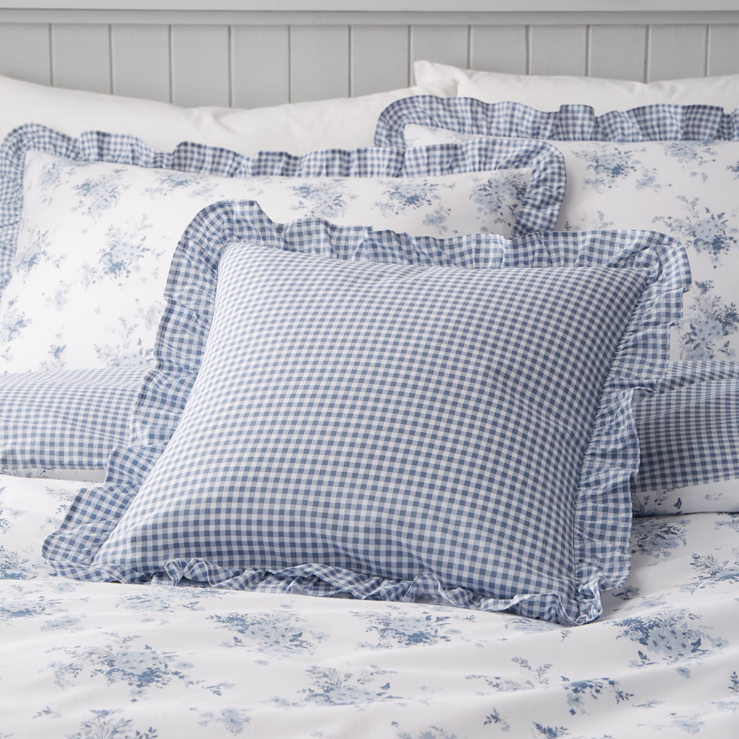 Lucie Floral Frill Fully Reversible Filled Cushion in White Blue by Catherine Lansfield