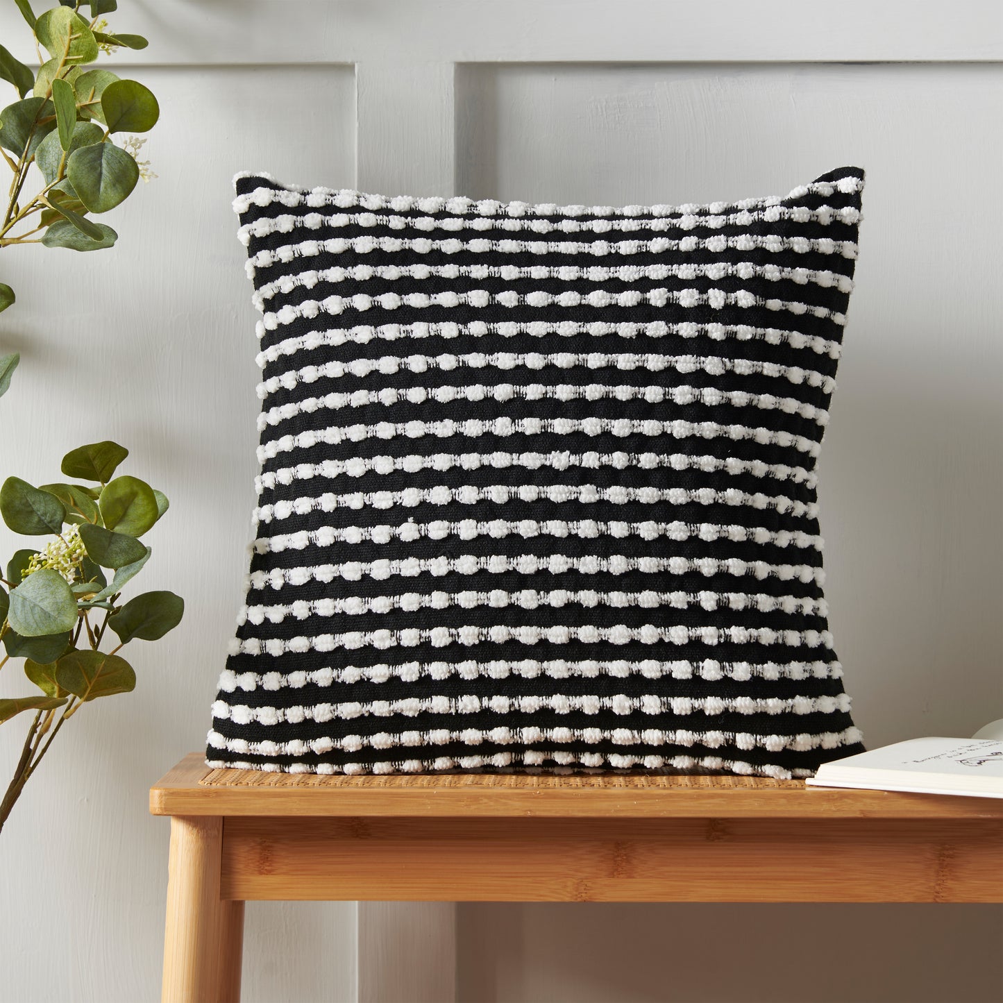 Stab Stitch Filled Cushion in Black by Catherine Lansfield