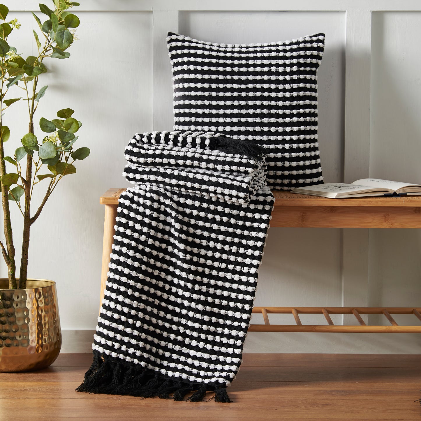 Stab Stitch Filled Cushion in Black by Catherine Lansfield