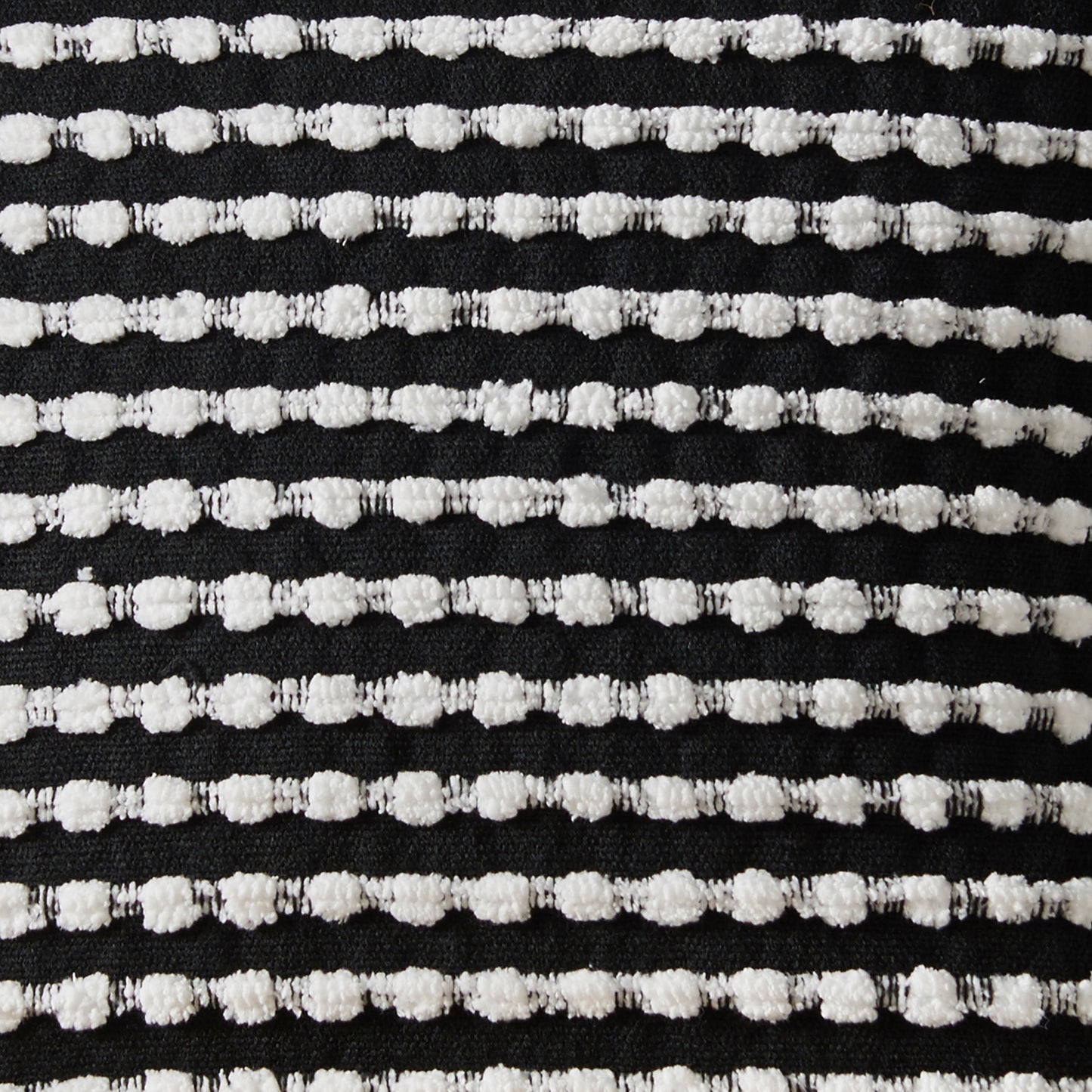 Stab Stitch Filled Cushion in Black by Catherine Lansfield