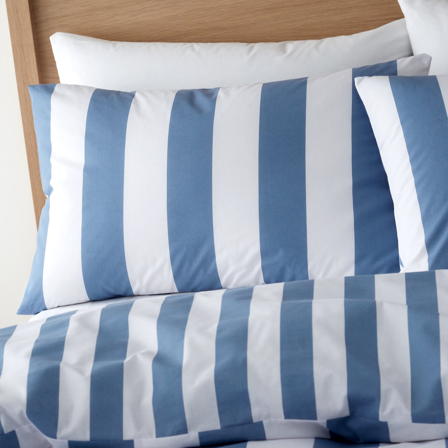 Cove Stripe Reversible Cover Set in Blue by Catherine Lansfield