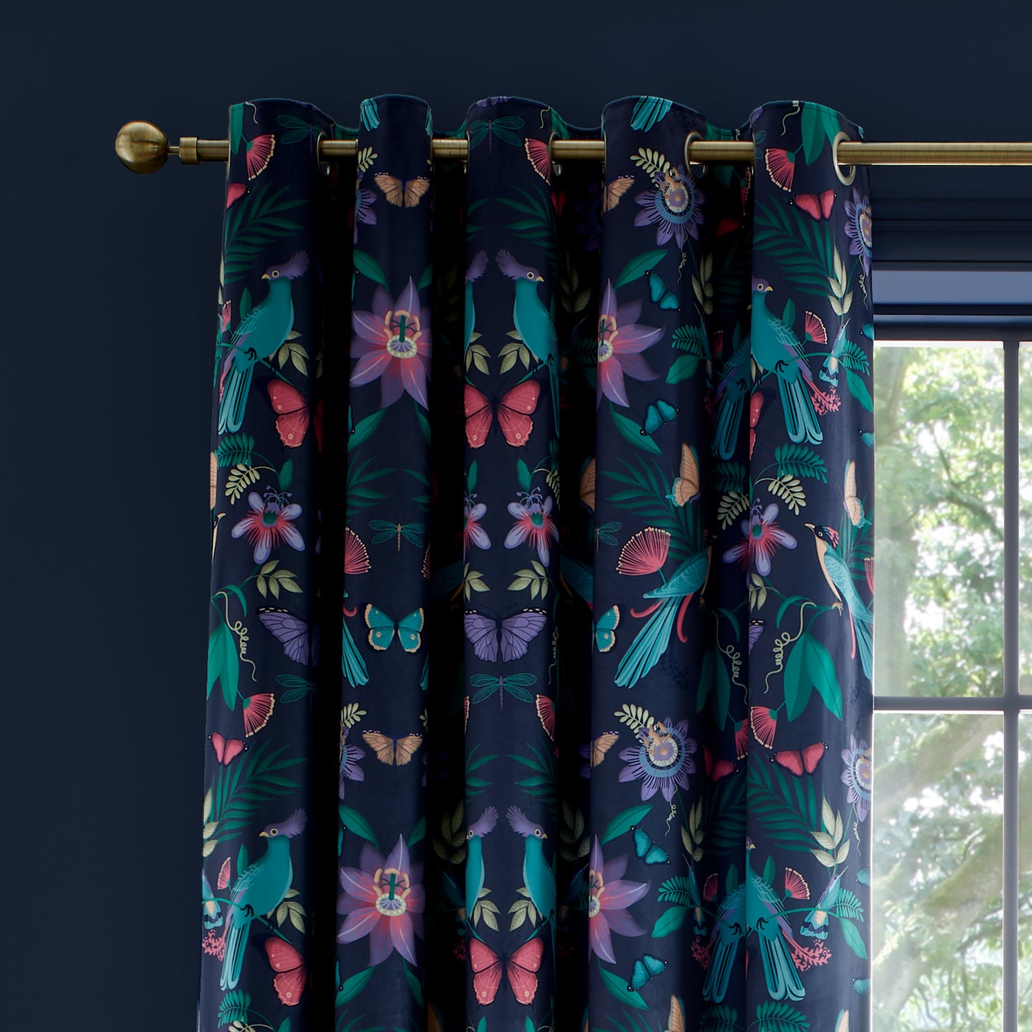 Mya Tropical Floral Lined Eyelet Curtains in Navy Blue by Catherine Lansfield