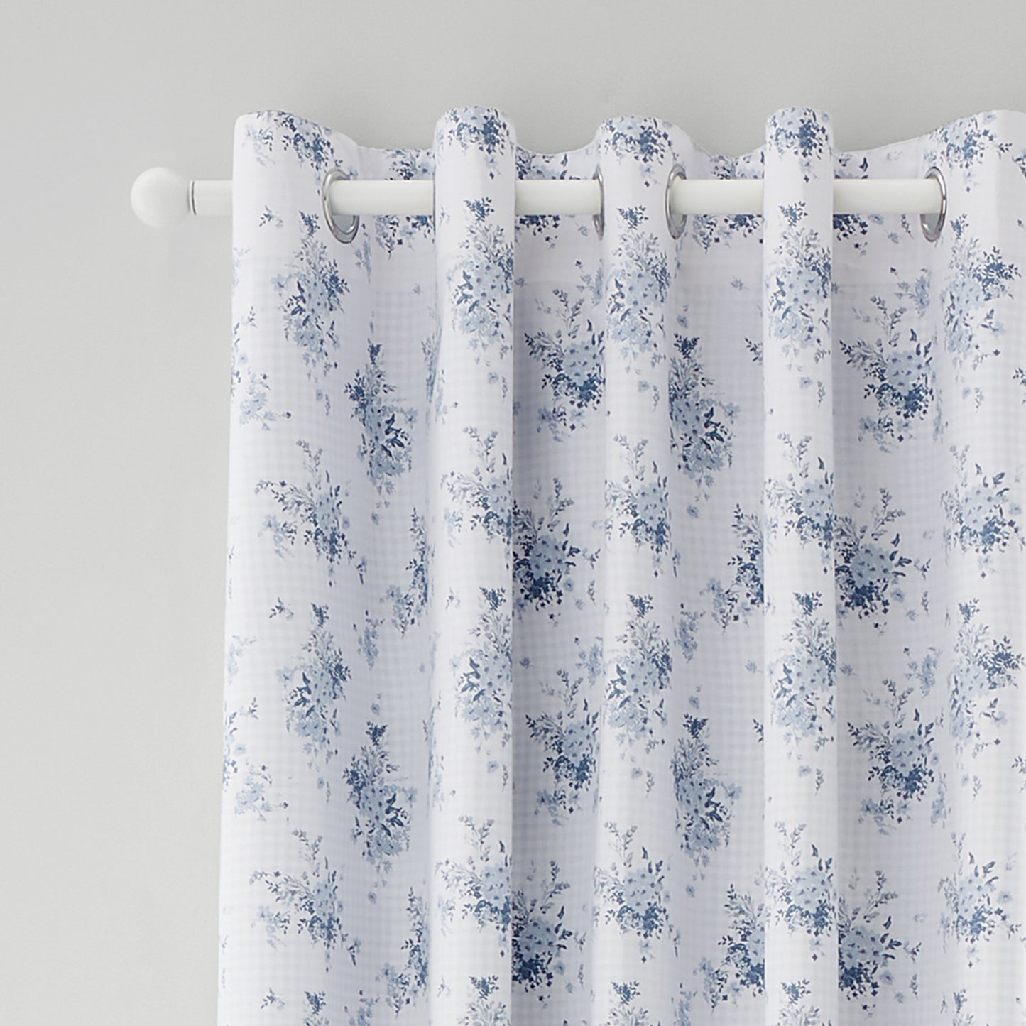 Lucie Floral Frill Fully Reversible 66x90 Inch Eyelet Curtains in Blue by Catherine Lansfield