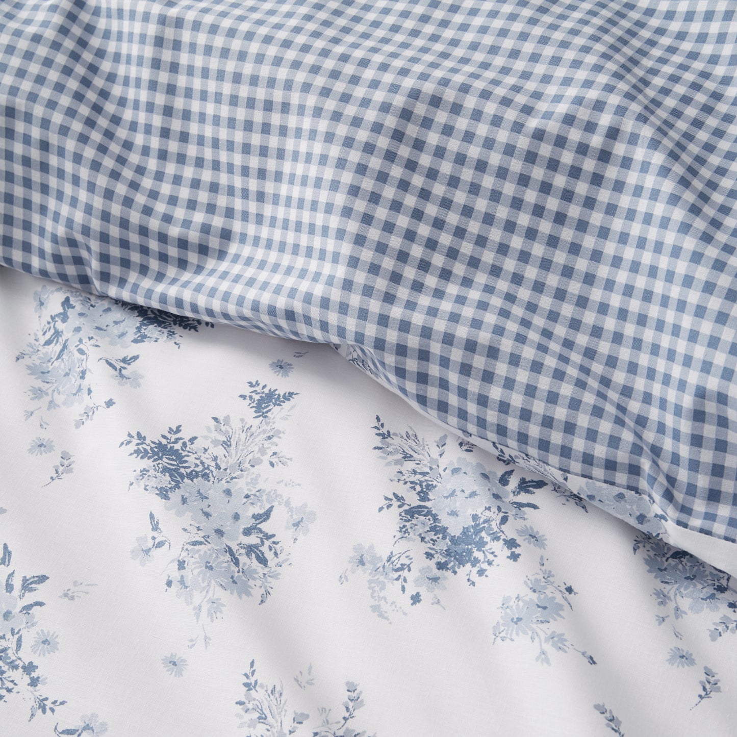 Lucie Floral Frill Reversible Duvet Cover Set in White Blue by Catherine Lansfield