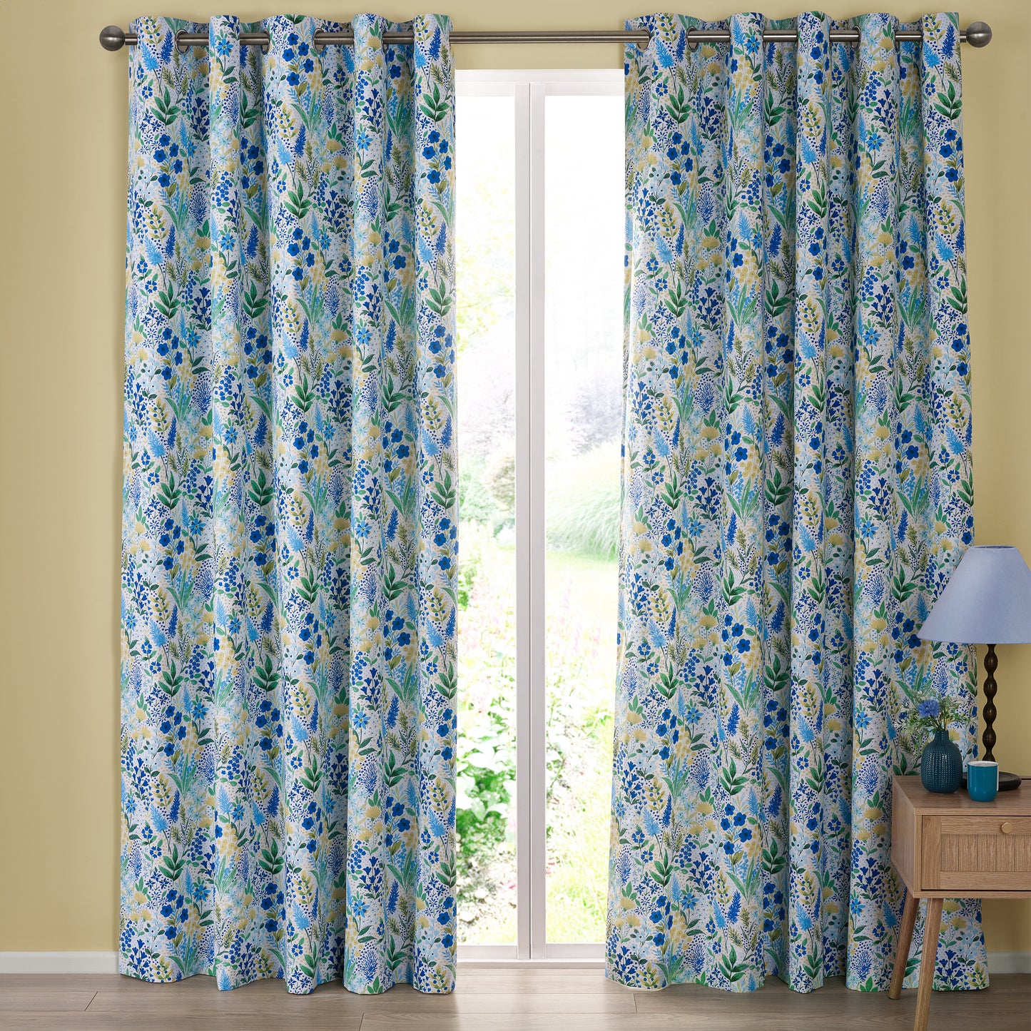 Tilly Floral Fully Reversible 66x90 Inch Eyelet Curtains in Blue by Catherine Lansfield