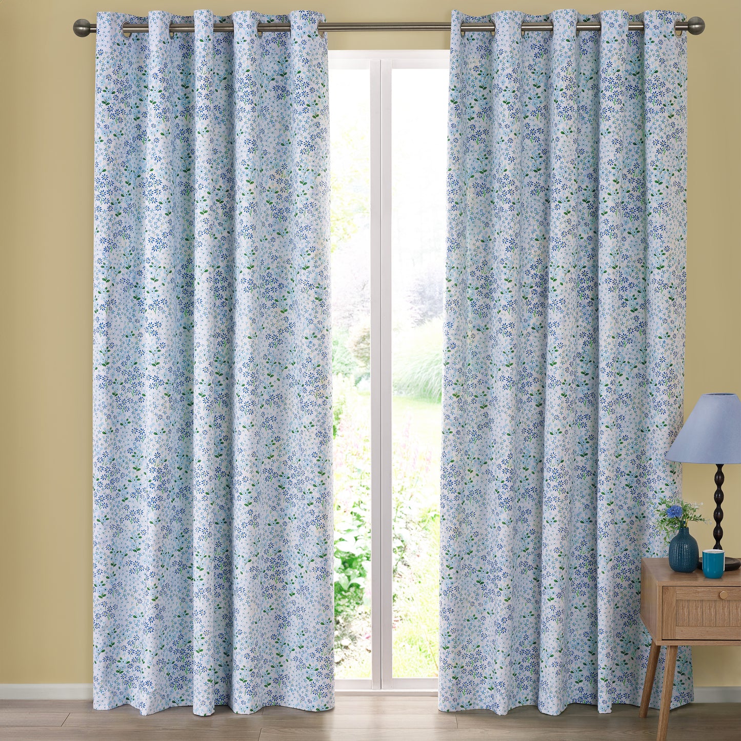 Tilly Floral Fully Reversible 66x90 Inch Eyelet Curtains in Blue by Catherine Lansfield