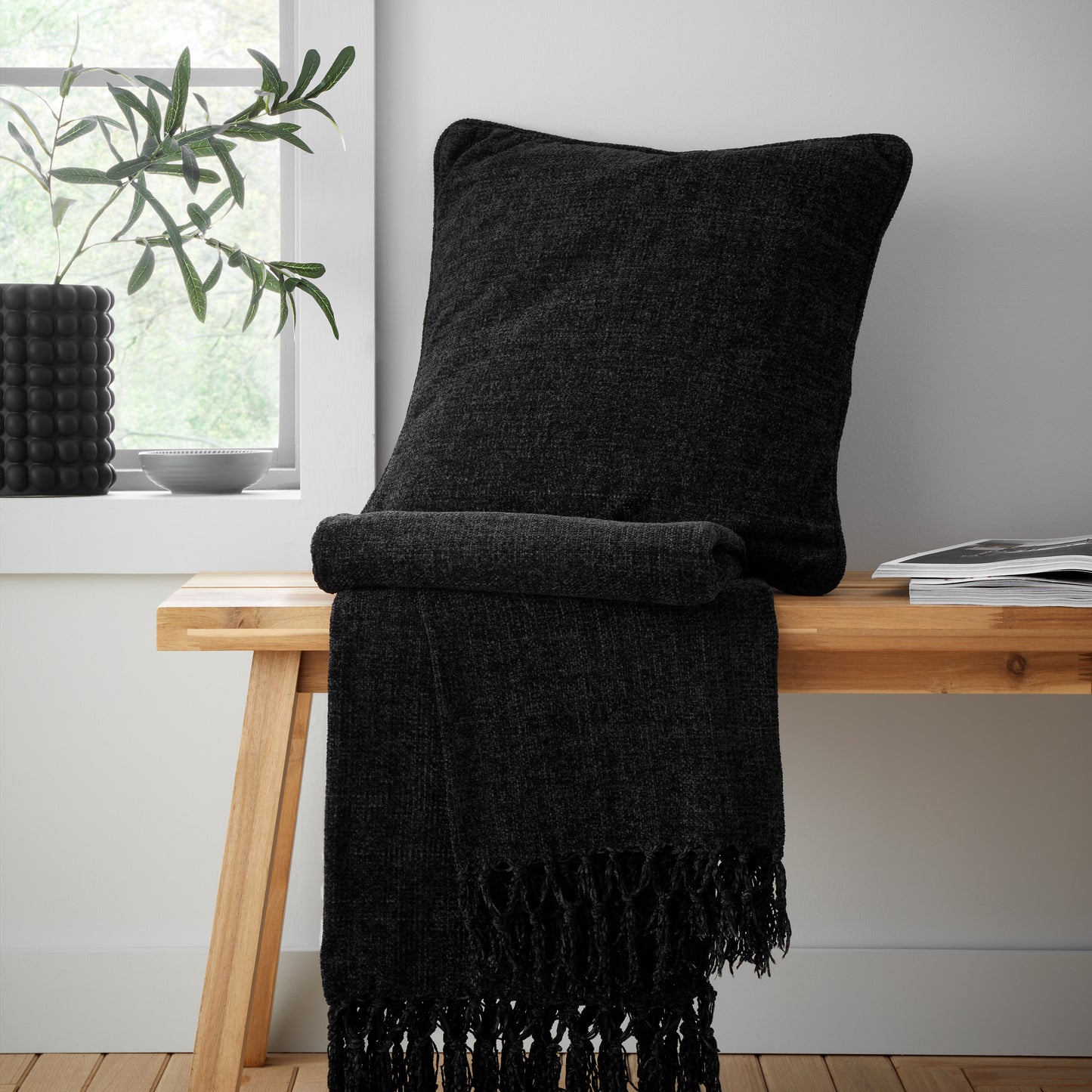 Wilson Plain Chenille Filled Cushion in Black by Catherine Lansfield