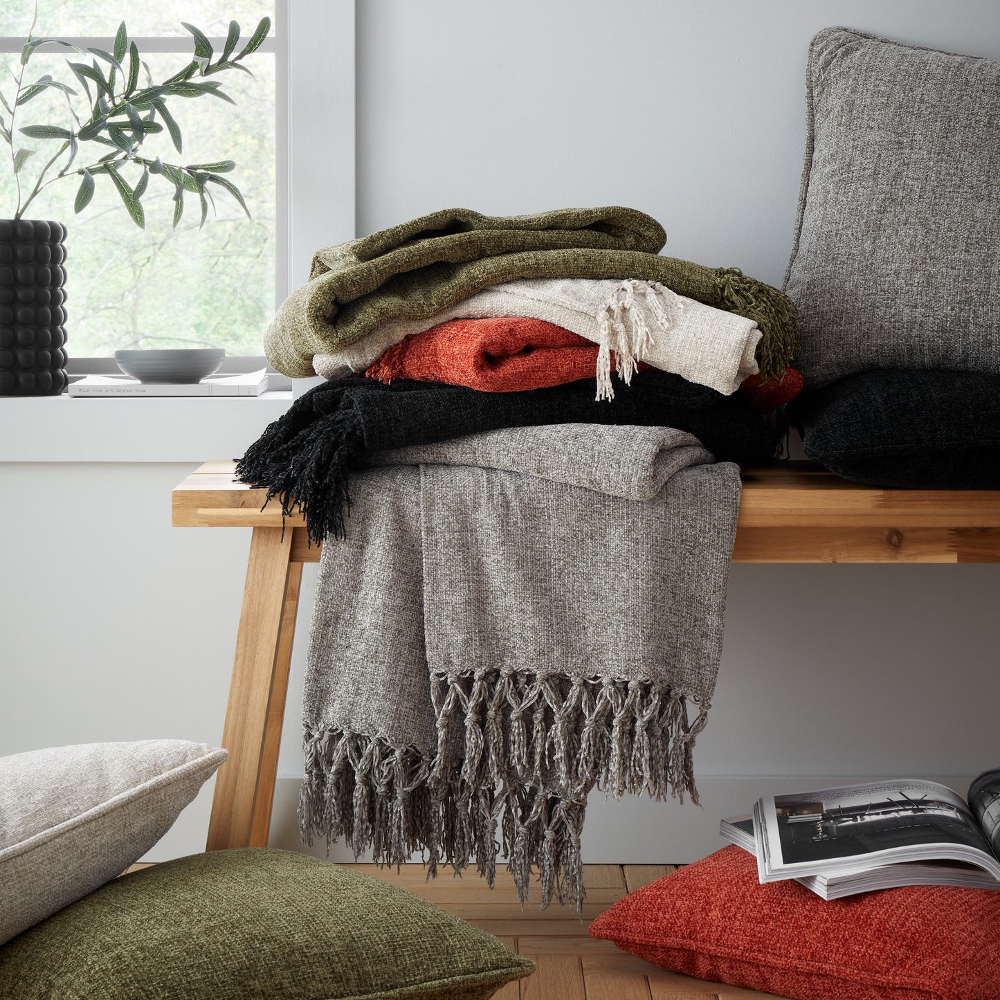 Wilson Plain Chenille Filled Cushion in Black by Catherine Lansfield