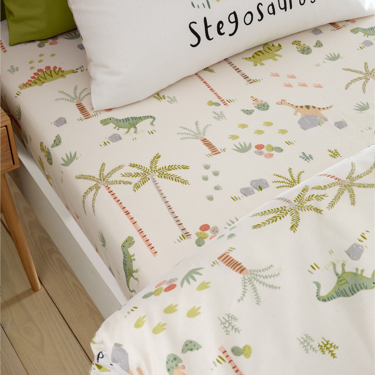 Sleepy Dino Fitted Sheet in Green by Catherine Lansfield