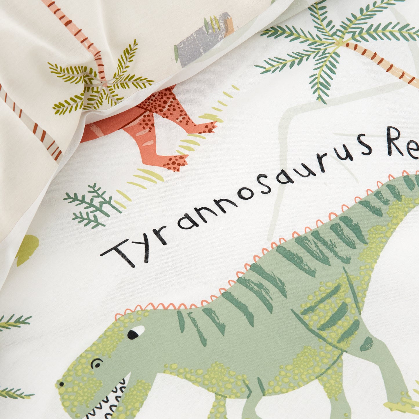 Sleepy Dino Reversible Duvet Cover Set in Green by Catherine Lansfield