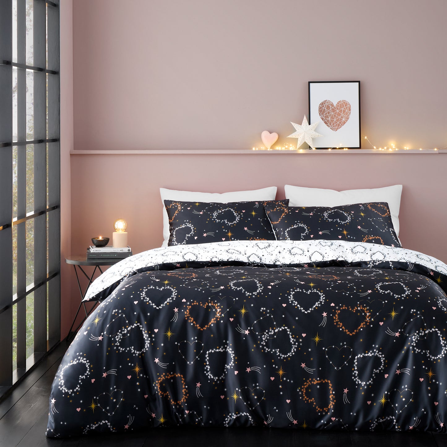 Cosmic Hearts and Stars Reversible Duvet Cover Set in Black by Catherine Lansfield