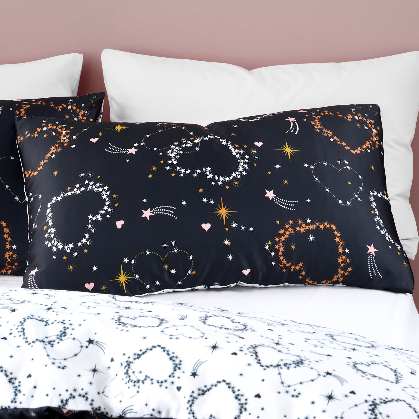 Cosmic Hearts and Stars Reversible Duvet Cover Set in Black by Catherine Lansfield