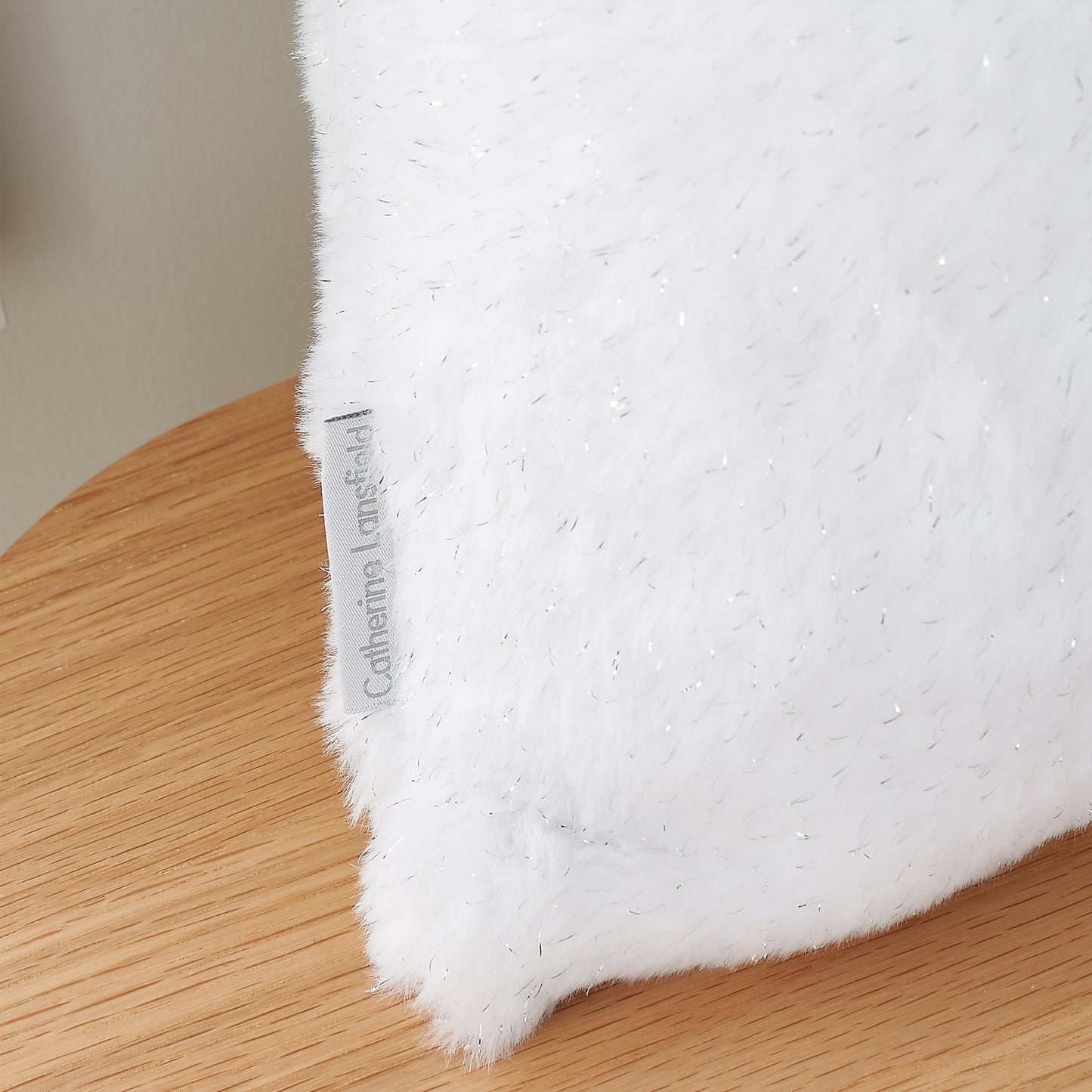 Cosy Glamour Fur Filled Cushion in White by Catherine Lansfield