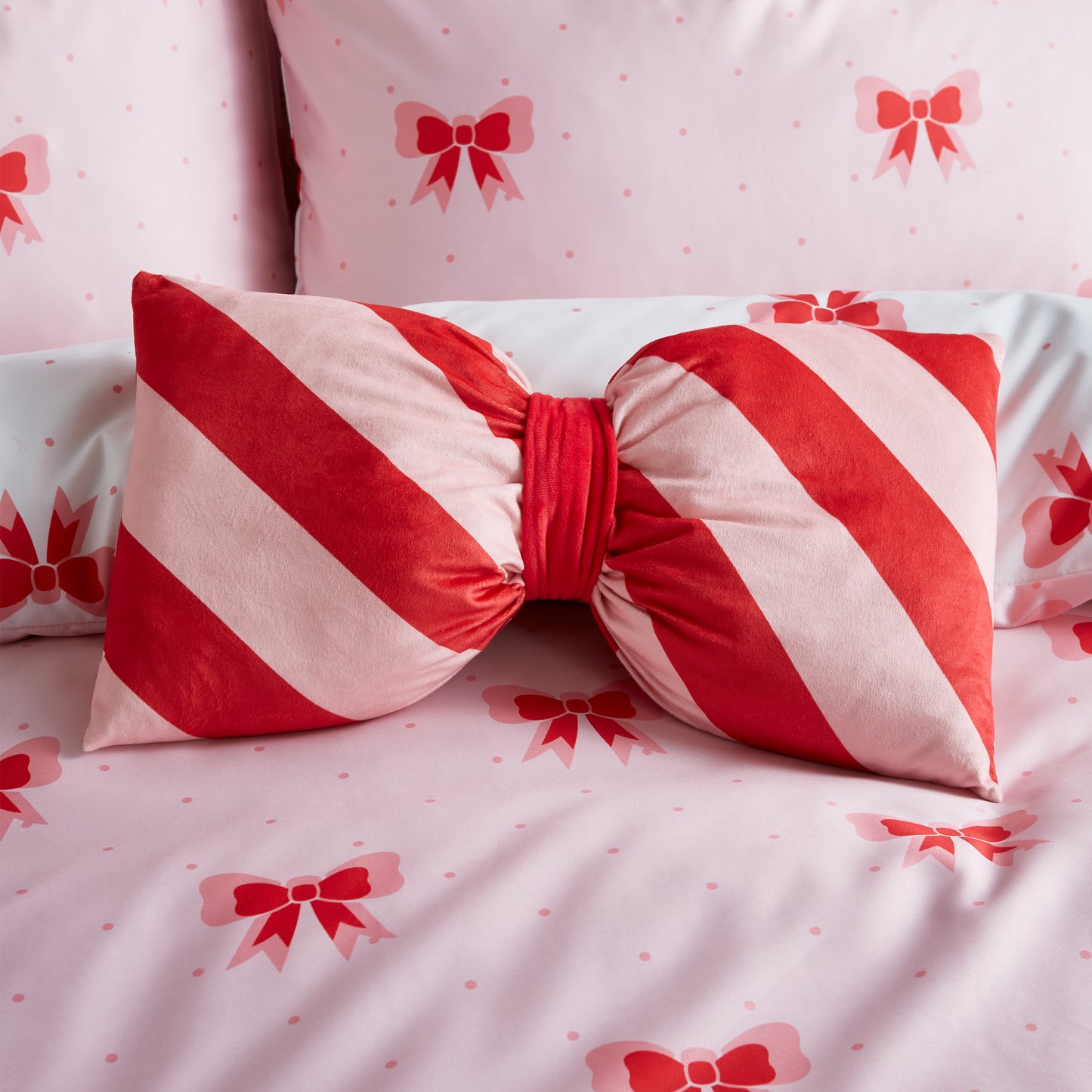 Dotty Bows 3D Shaped Cushion in Pink by Sassy B