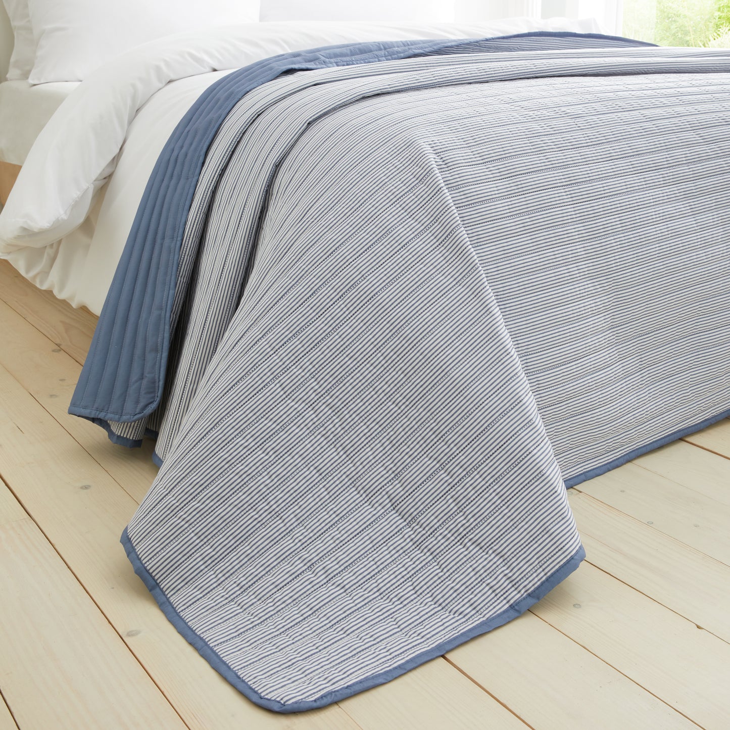 Stripe Quilted Reversible Bedspread in Blue by Catherine Lansfield