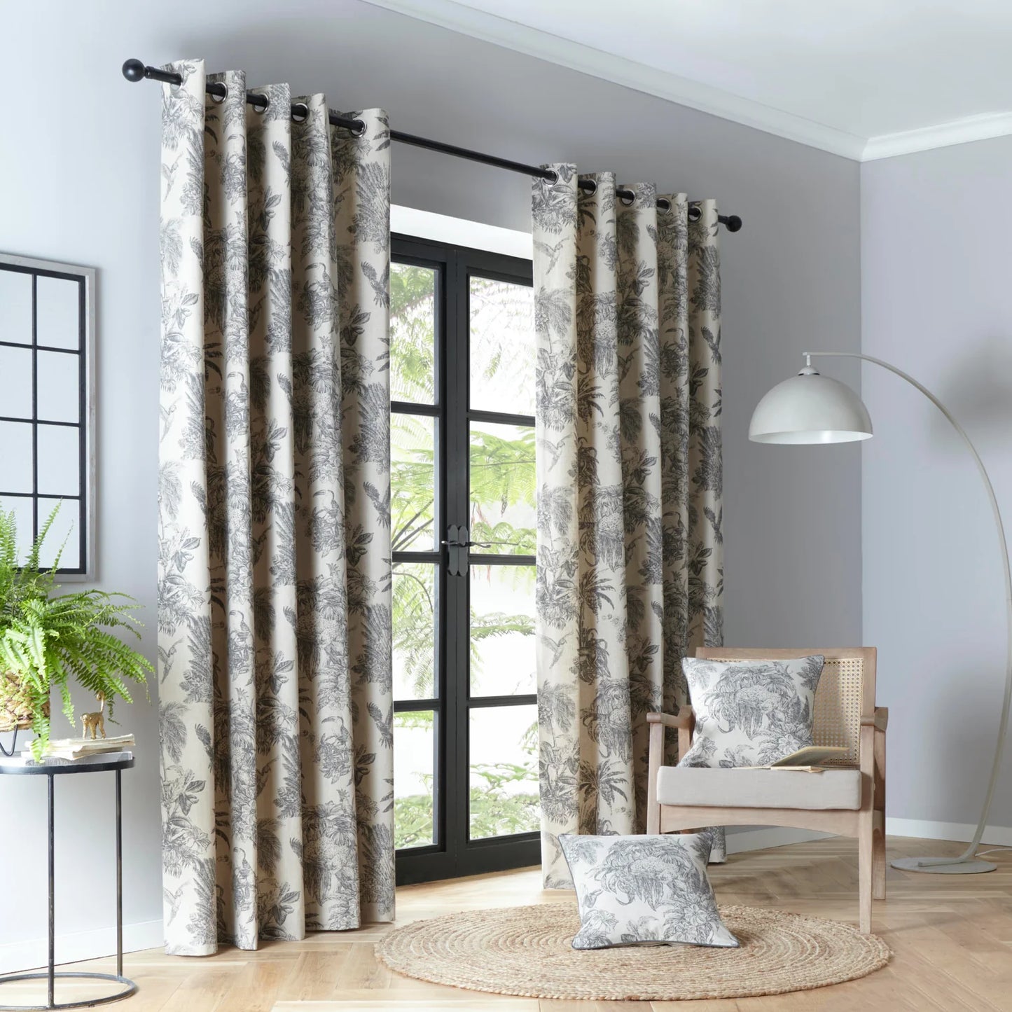 Saranda Jungle Lined Eyelet Curtains by Fusion in Charcoal