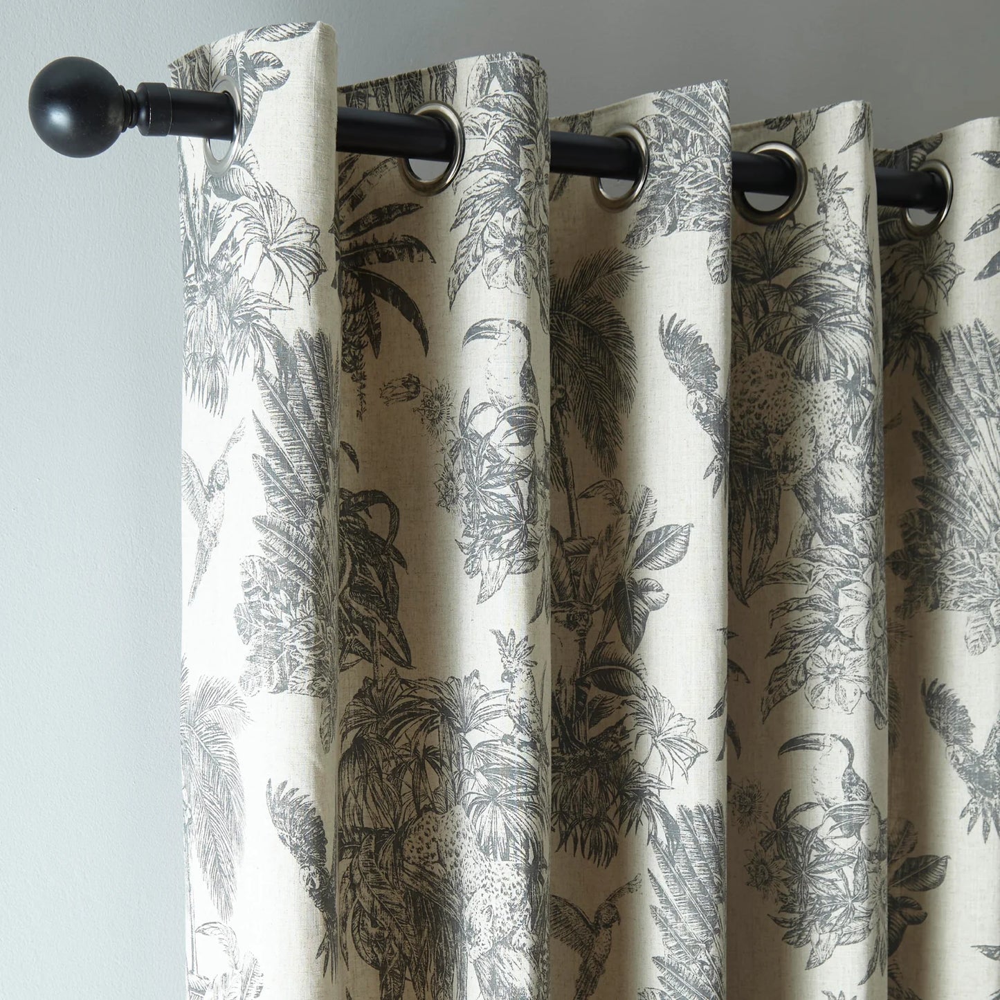 Saranda Jungle Lined Eyelet Curtains by Fusion in Charcoal